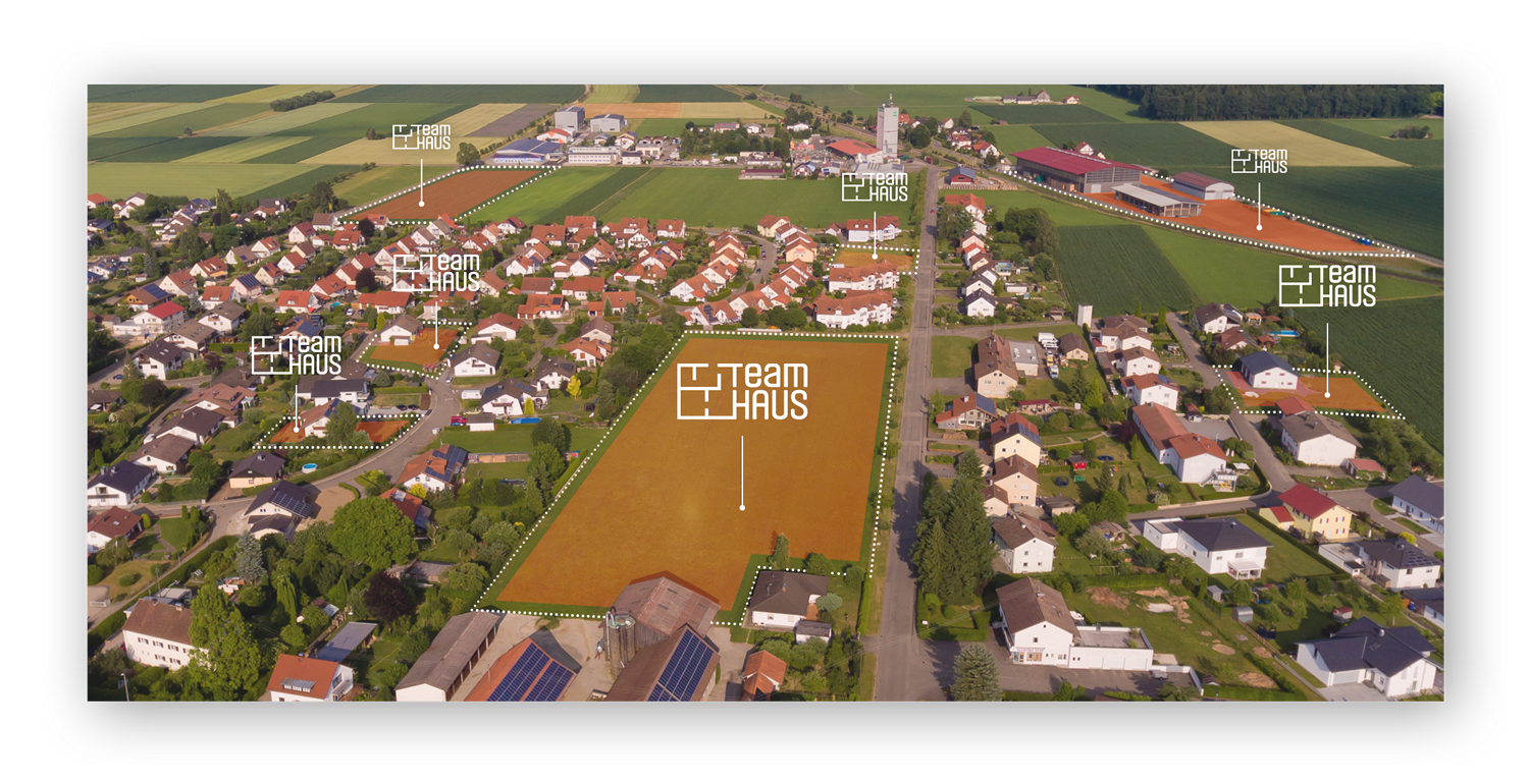Luftbild eines Dorfes mit möglichen Grundstücken für das TeamHaus